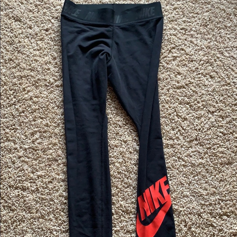 Black Nike leggings with Red Nike logo